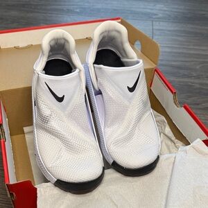 Nike woman’s  White Slip-On Sneakers with Black Swoosh